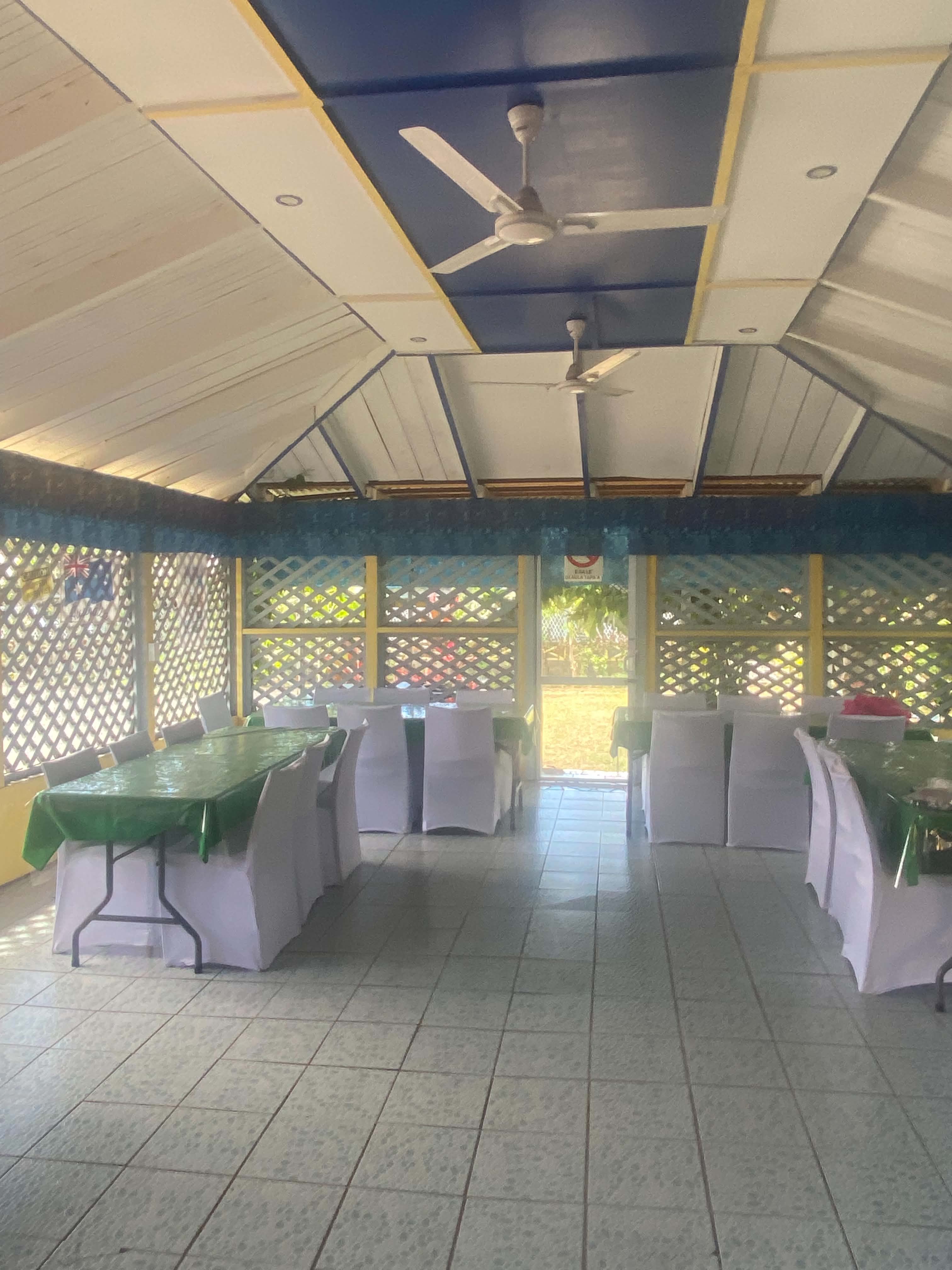 Covered dining and seating area overlooking the garden at Livingstone