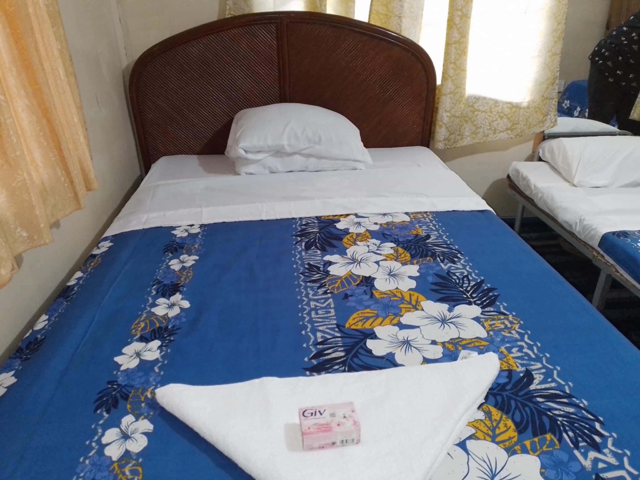 Guest room showing a double bed and a single bed